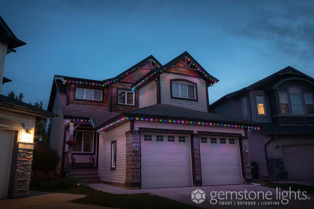 Permanent Christmas lights in Kamloops illuminate a beautifully decorated house at twilight